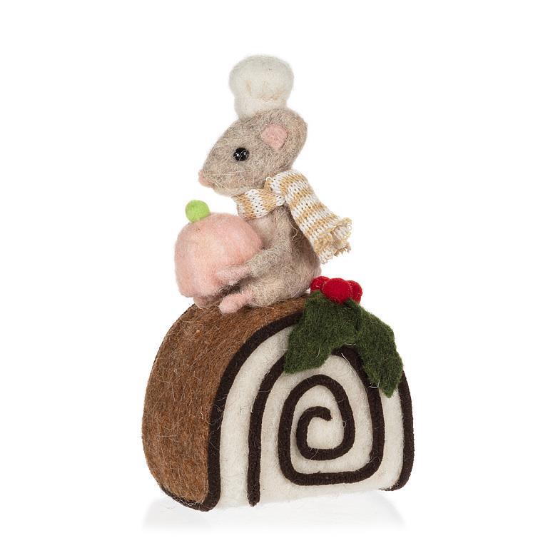 Felted mouse with a scarf on a felted swiss roll with holly leaves and berries on a white background