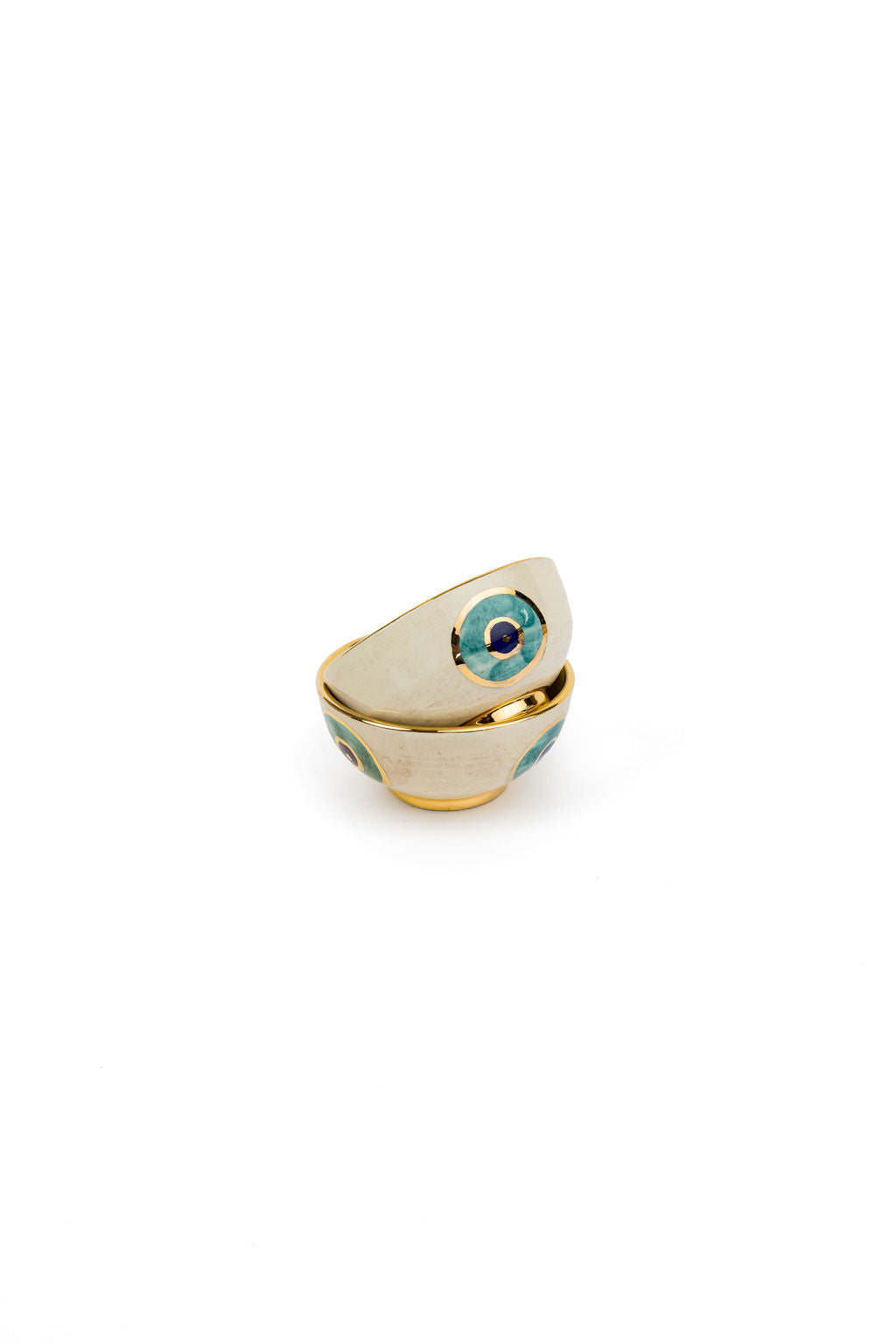 small beige and gold evil eye bowl