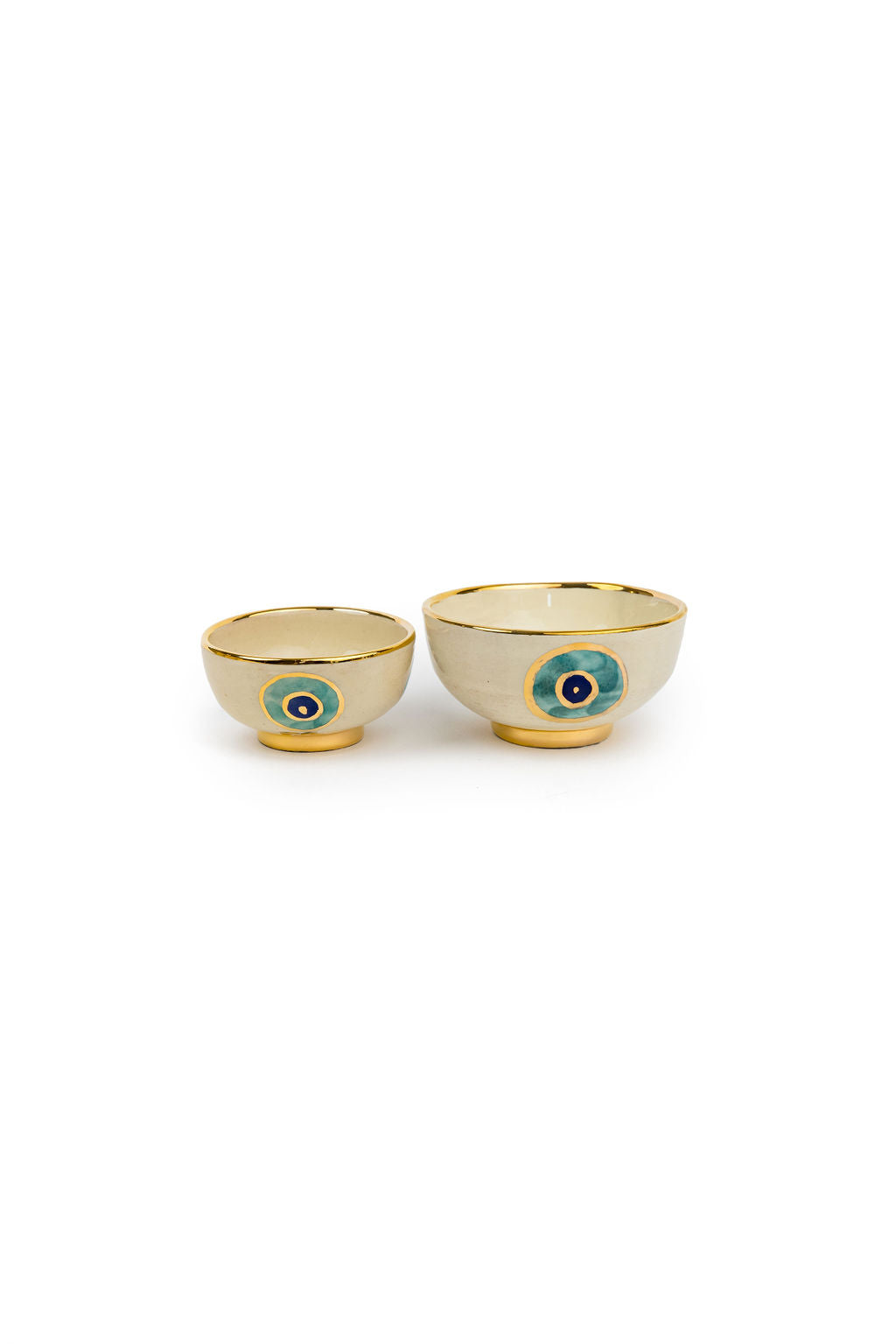 small beige and gold evil eye bowl