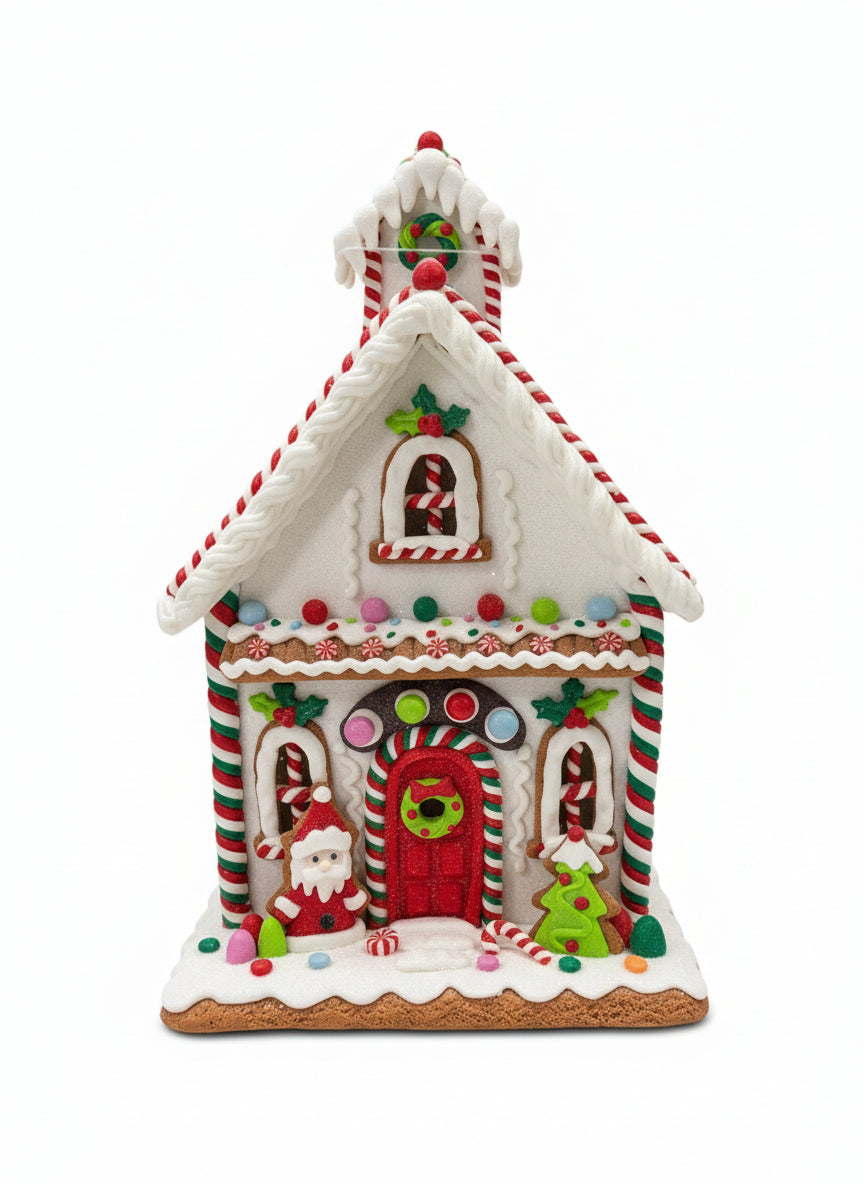 Decorative gingerbread house on a concrete surface