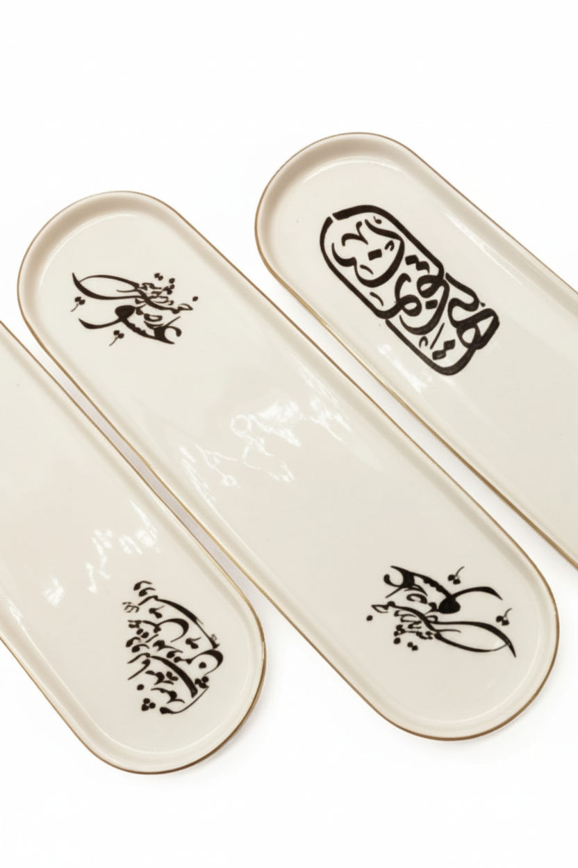 Two white trays with black decorative patterns on a white background