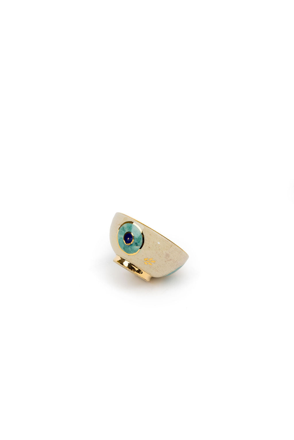 small beige and gold evil eye bowl